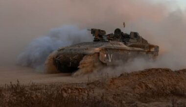 An Israeli military armoured vehicle rolls in an area bordering the Gaza Strip on June 9, 2024, amid the ongoing conflict between Israel and the Palestinian Hamas militant group. (Photo by MENAHEM KAHANA/AFP via Getty Images)