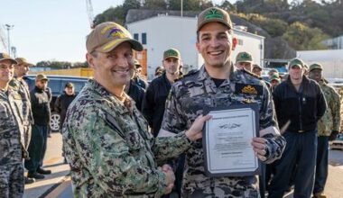 Australian officer, training for nuclear sub operations, earns US Navy ‘dolphins’