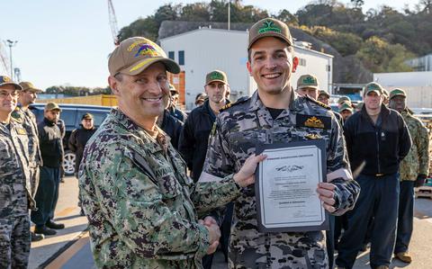 Australian officer, training for nuclear sub operations, earns US Navy ‘dolphins’
