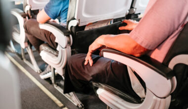 Passengers seated on a plane.