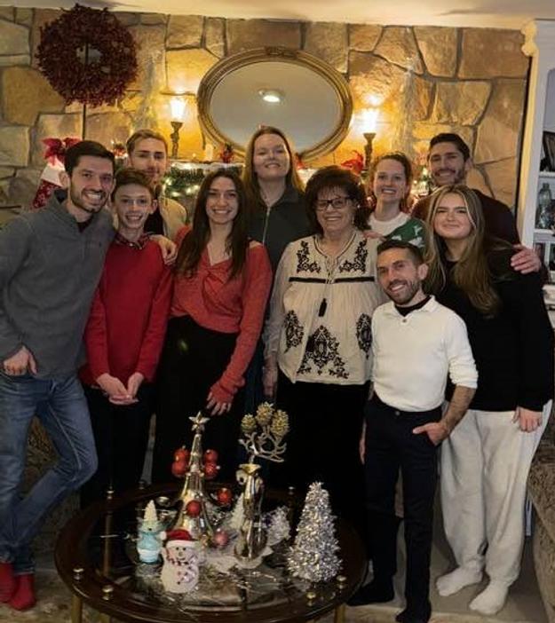 Grandma Joyce with her grandchildren Nicholas (far left), Matthew, Luciano, Kaitlin, Anne, Gabrielle, Alexander, Mark and Julie. Christmas 2023.