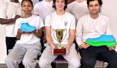 The members of the winning team (nicknamed the "Hopeful Flying Penguins") for the SUNY Potsdam Business Plan Competition posed for a photo along with their trophy and product prototype after class. The student group included (clockwise, from top left): Junior Oduro, Drew Rose, David Scovil, Teddy Morey, Ben Lagoner and Tawaiian Holmes.: