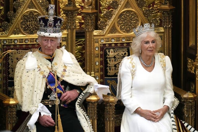 The King and Queen, seated on thrones, during the State Opening of Parliament 