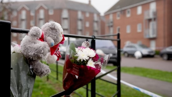 Floral tributes have been laid near the scene where two women died on Christmas Day (Joe Giddens/PA)