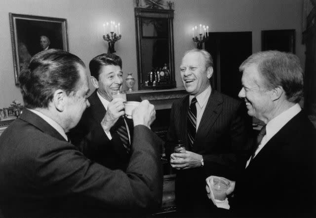 Getty President Ronald Reagan toasts with his three predecessors before they depart for Anwar El-Sadat's funeral in Egypt