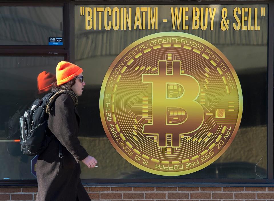A sign advertises a Bitcoin cryptocurrency ATM at a shop in Halifax on February 4, 2020. Bitcoin is created, distributed, traded and stored with the use of a decentralized ledger system known as blockchain, a technology on which a House of Commons committee recommended the federal government develop a national strategy.