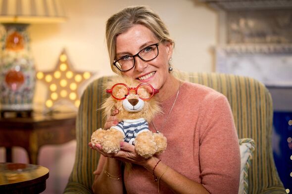 Duchess of Edinburgh with a bear with red glasses