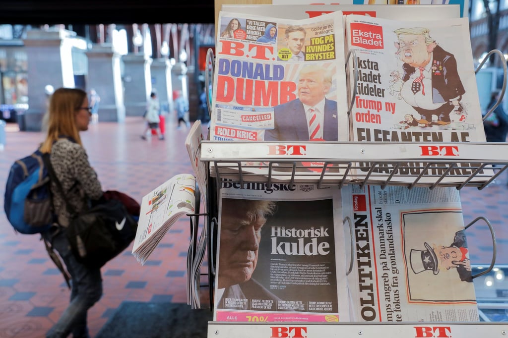 A person in Copenhagen stands at a newspaper kiosk with reactions to Donald Trump’s cancellation of his trip to Denmark after Prime Minister Mette Frederiksen’s refusal to discuss the sale of Greenland on August 22, 2019. Photo: Reuters A person in Copenhagen stands at a newspaper kiosk with reactions to Donald Trump’s cancellation of his trip to Denmark after Prime Minister Mette Frederiksen’s refusal to discuss the sale of Greenland on August 22, 2019. Photo: Reuters