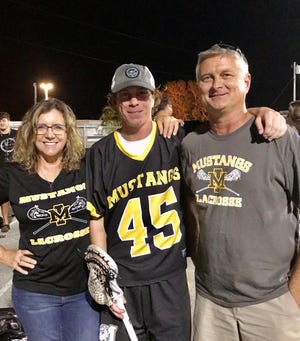 Kelly Haskins of Merritt Island, left, seen with her son, Hunter, and husband Andy, started the nonprofit "Do It For Hunter" in the wake of her son's suicide. The nonprofit was named for a "Rising Star" award at 211's Stars of the Space Coast Awards ceremony Dec. 6.