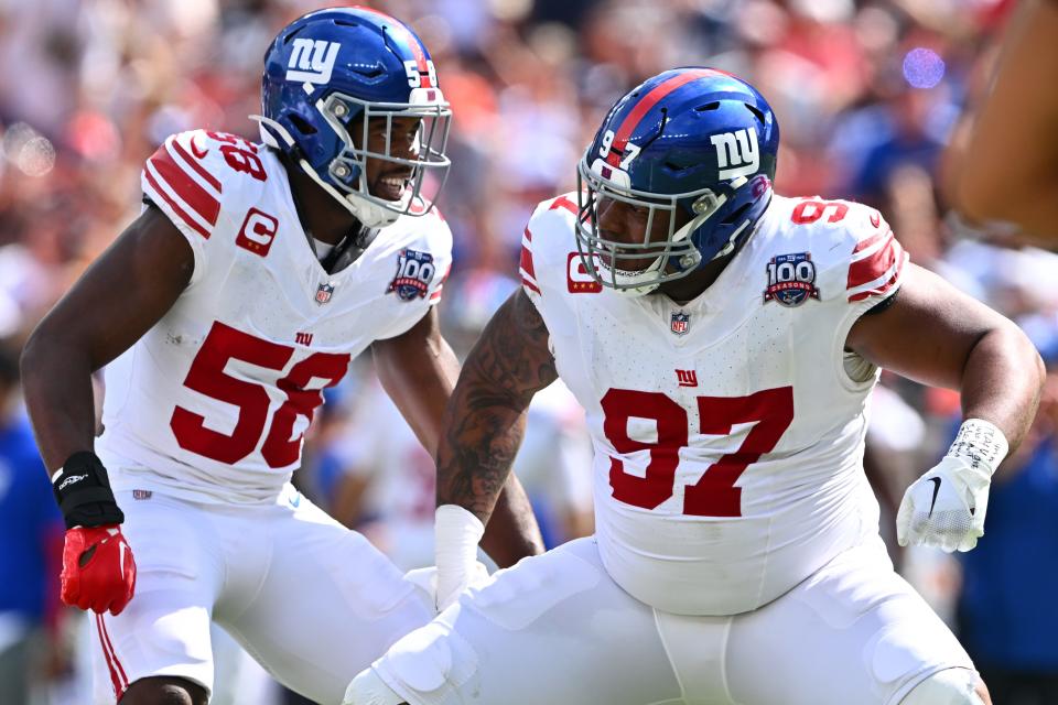CLEVELAND, OHIO - SEPTEMBER 22: Bobby Okereke #58 and Dexter Lawrence II #97 of the New York Giants celebrate after a stop against the Cleveland Browns at Cleveland Browns Stadium on September 22, 2024 in Cleveland, Ohio. (Photo by Jason Miller/Getty Images)