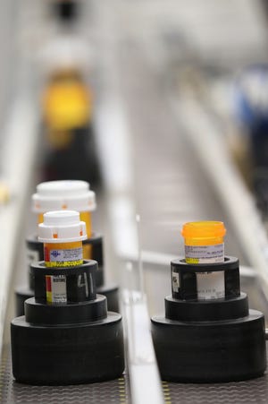 MIDVALE, UT - SEPTEMBER 10: Bottles of prescription drugs are filled as they move down an automated line at the central pharmacy of Intermountain Heathcare on September 10, 2018 in Midvale, Utah. Prescription drug prices have risen in recent years.