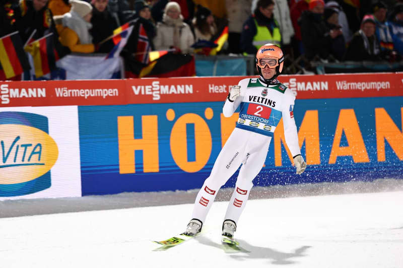 Austria's Stefan Kraft celebrates after the 2nd round of the Men's Large Hill Tournament of the FIS Ski Jumping World Cup. Daniel Karmann/dpa
