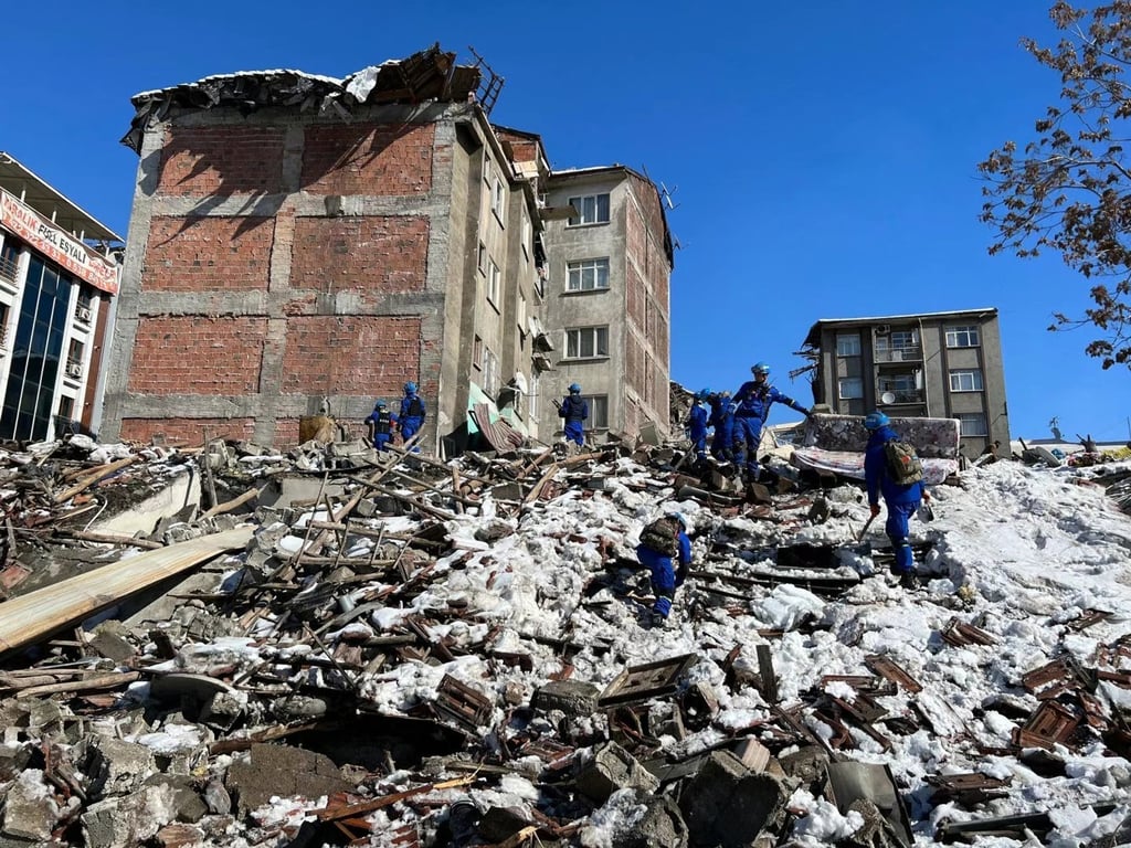 Blue Sky Rescue team members on the rubble in Malatya, Turkey, in February 2023, after the region was hit by a magnitude 7.8 earthquake. Photo: Ming