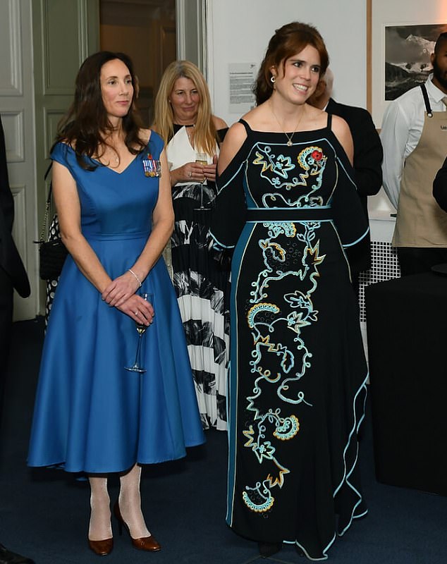 She looked glamorous in a black cold-shouldered Peter Pilotto gown adorned with a floral embroidered pattern as well as turquoise piping and a tie belt