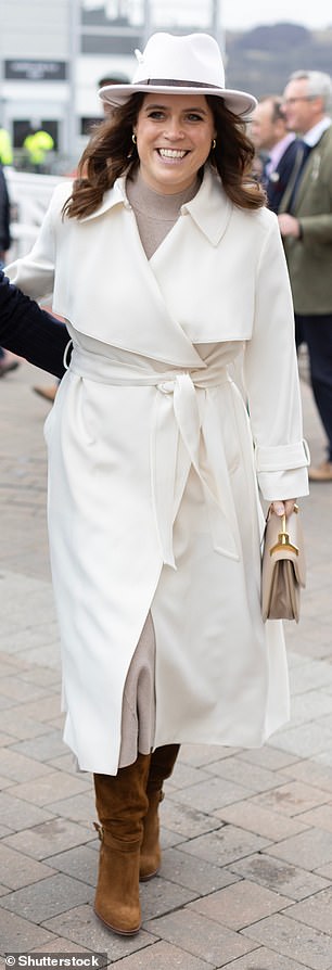 At Cheltenham Festival, Eugenie wrapped up in a camel knitted dress and off-white trench coat, both by Reiss