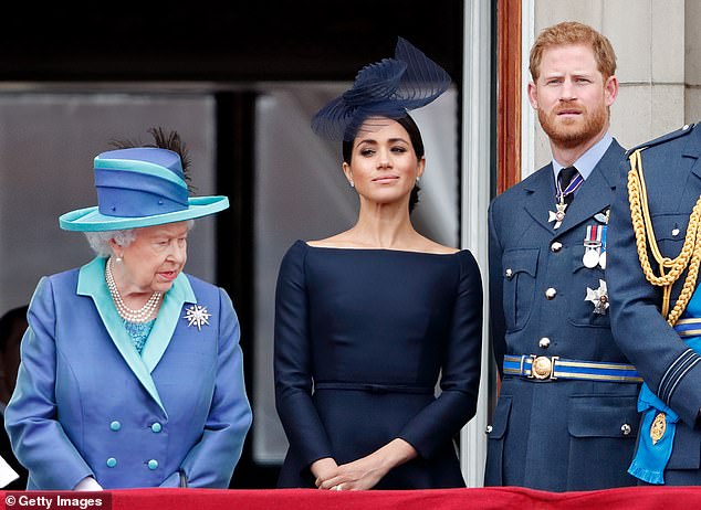 The late Queen Elizabeth appearing on the balcony at Buckingham Palace with Meghan Markle and Prince Harry in 2018