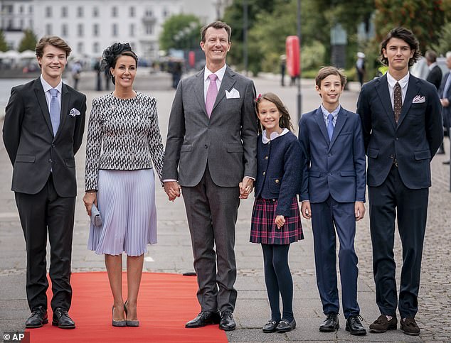 This year, however, they won't be joined by his younger brother Prince Joachim (centre) and his wife Princess Marie (second left). Pictured with Felix, Athena, Henrik and Nikolai in September 2022