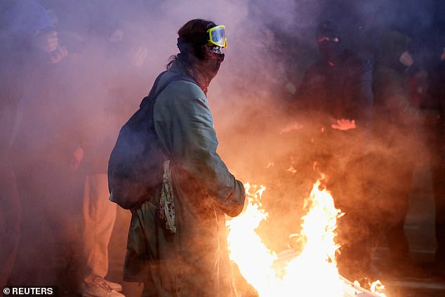 A demonstrator takes part in a protest against the new government's decision to suspend the European Union accession talks and refuse budgetary grants until 2028, outside parliament in Tbilisi, Georgia November 30, 2024