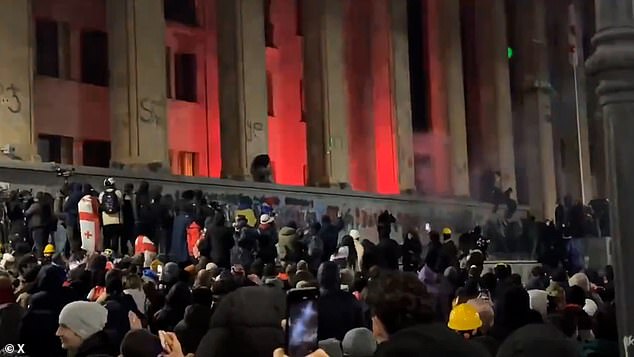 The country's parliament building was set alight by rioters
