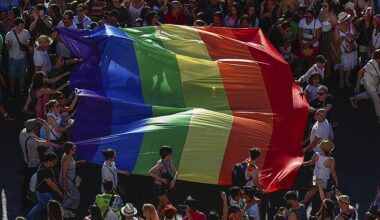 Participants of the annual LGBTQ pride parade carry the rainbow flag in Madrid, Spain