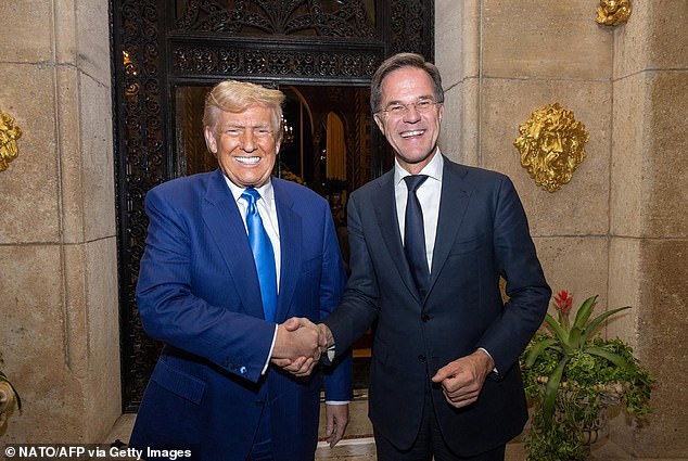 US President-elect Donald Trump shakes hands with NATO Secretary General Mark Rutte as they met in Palm-Beach, Florida on November 22