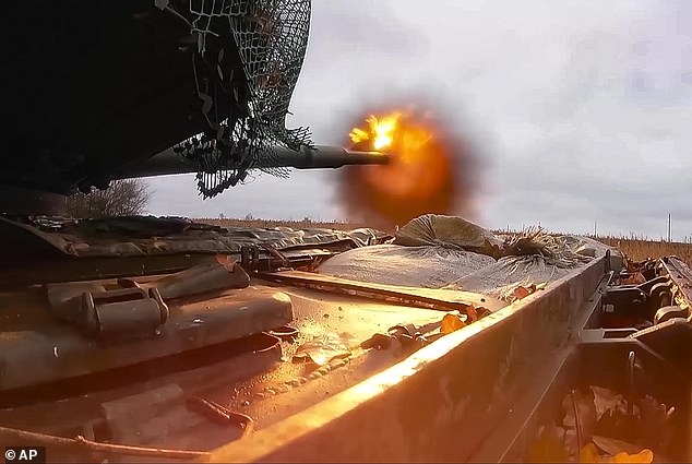 A Russian T-80BVM tank fires towards Ukrainian positions at an undisclosed location in Ukraine last month