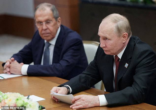 Russian President Vladimir Putin and Foreign Minister Sergei Lavrov