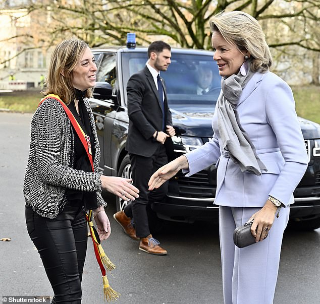 She was also pictured shaking hands with the Liège governor representative Aurelie Royer outside the venue