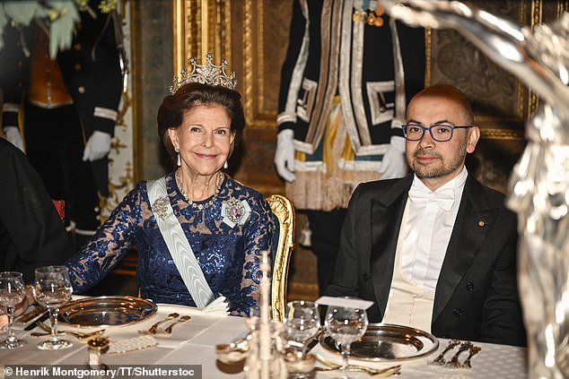 Queen Silvia was seated next to chemistry laureate Demis Hassabis (pictured) during the dinner last week