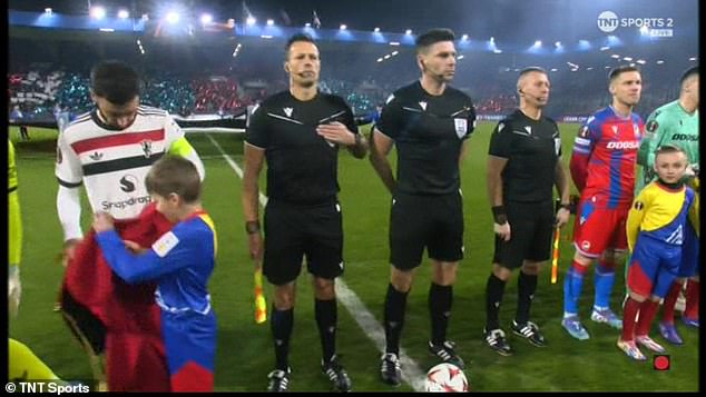 The Red Devils captain handed the child his jacket ahead of kick-off against Viktoria Plzen