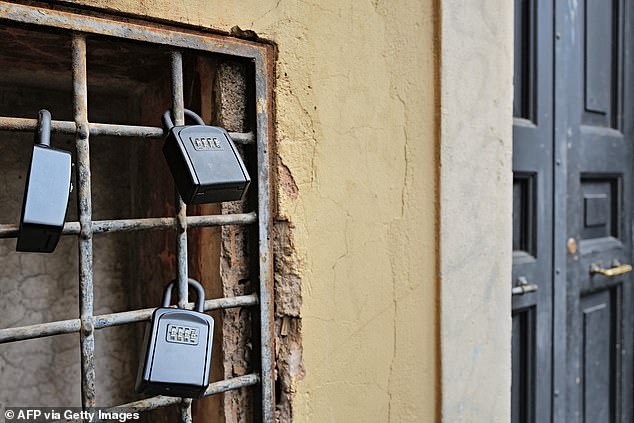 The anonymous protesters calling themselves 'Robin Hood' have used glue to sabotage key boxes to Airbnbs in the historic Trastevere district of Rome (file image of key boxes in Trastevere)
