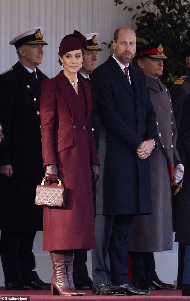 Kate greeted the Amir of Qatar during his state visit to the UK in a flawless burgundy ensemble