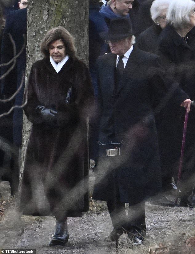 Queen Silvia and King Carl Gustaf led the family out of the Royal Cemetery in Hagaparken following Princess Birgitta's funeral