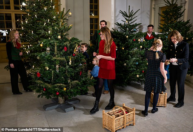 Many of the girls were dressed in festive attire consisting of patterned dresses, while the boys dressed in shirts and jumpers for the occasion