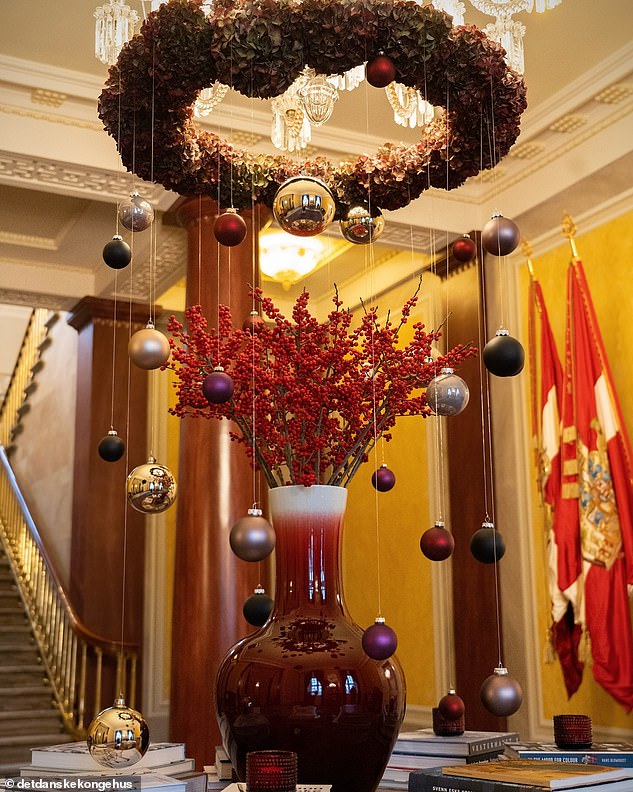 A magnificent display of baubles hang from a foyer in the royal residence