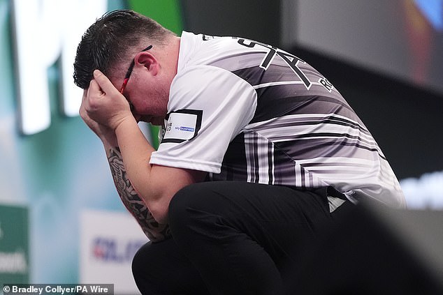 Robert Owen reacts after winning his second round match against Gabriel Clemens on day five of the Paddy Power World Darts Championship at Alexandra Palace