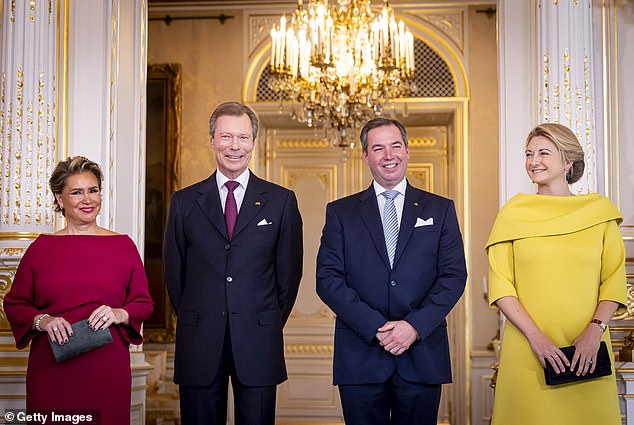 Grand Duke Henri (second from left), with Grand Duchess Maria Teresa (left), and Guillaume (second from right) with his wife, Grand Duchess Stephanie of Luxembourg (right)