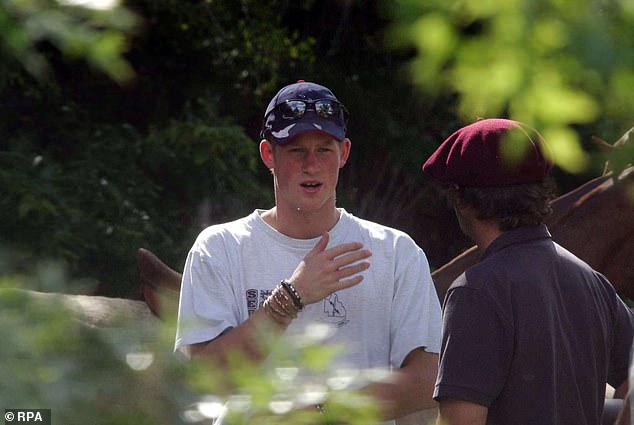 Prince Harry observes a polo game in Buenos Aires, Argentina where his friends, the Tomlinson brothers played