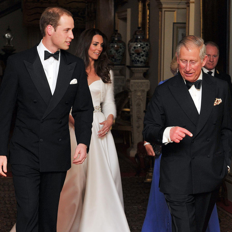 Prince William and his father, King Charles, talk on William's wedding day with Kate Middleton.