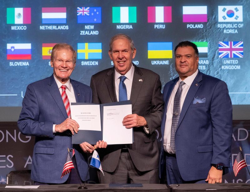 NASA Administrator Bill Nelson, left, Ambassador of the Republic of Panama to the United States of America José Miguel Alemán Healy, center, and U.S. Department of State Principal Deputy Assistant Secretary in the Bureau of Oceans and International Environmental and Scientific Affairs Tony Fernandes pose for a picture after the Republic of Panama signed the Artemis Accords on Wednesday. Photo by NASA/Joel Kowsky