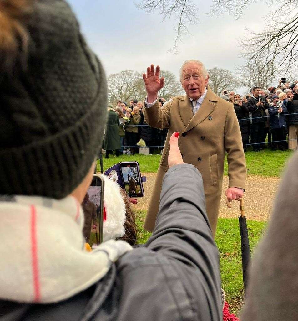 The King waves to Sharron Tonge at Sandringham.