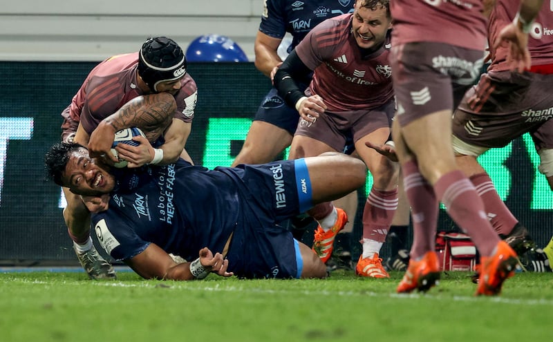 Castres’ Abraham Papalii scores their first try despite the efforts of Thaakir Abrahams of Munster. Photograph: Dan Sheridan/Inpho
