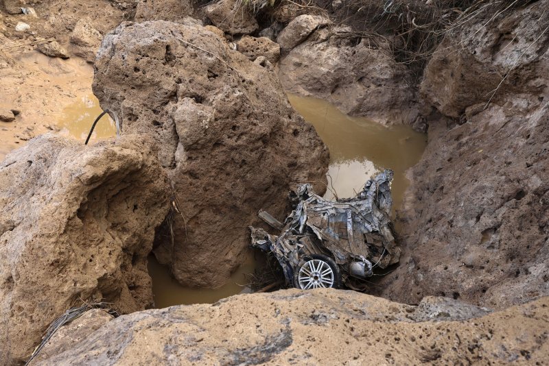 The wreckage of a car swept away and pulverized in flash flooding in November in the flood-hit municipality of Letur in Albacete province, Spain. The European Union's global warming watchdog warned Monday that November was the warmest ever and the 16th month in 17 months in which global average surface air temperature rise exceeded 1.5 degrees Celsius. File photo by Ismael Herrero/EPA-EFE