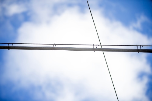 Various wires between telephone poles overhead