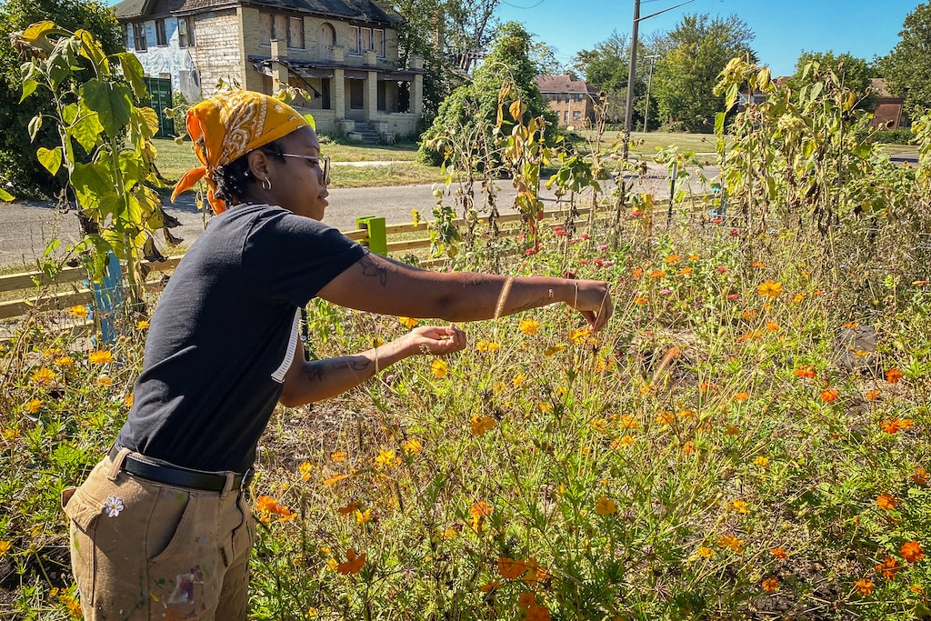 Amanda Brezzell, co-founder of Fennigan's Farms, works the urban farmland on a Saturday in September.