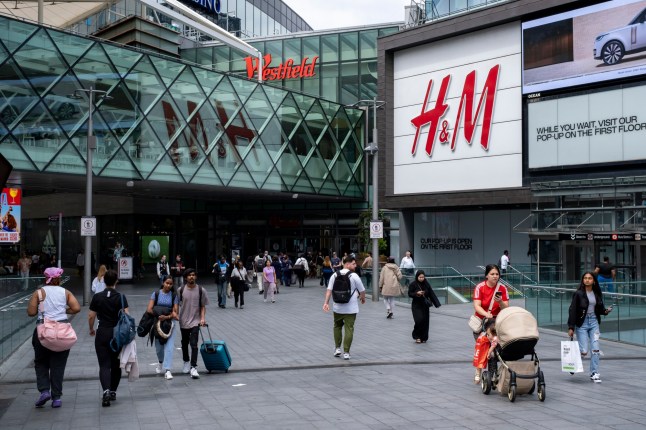 People walking towards and away from Westfield Shopping Centre in Stratford on 1st July 2024 in London, United Kingdom. This is Europes largest shopping complex. Stratford is now East Londons primary retail, cultural and leisure centre. It has also become the second most significant business location in the east of the capital. (photo by Mike Kemp/In Pictures via Getty Images)