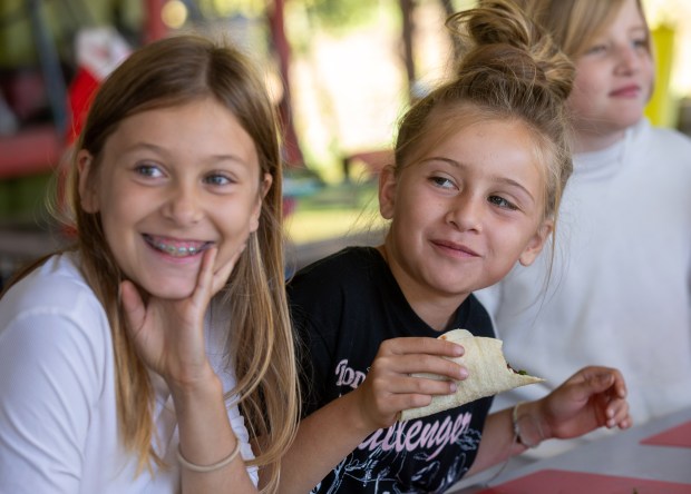 El Granada Elementary School 3rd graders taste the veggie tacos they made after harvesting produce during a farm field trip with the Heal Project, Wednesday, Oct. 23, 2024, in Half Moon Bay, Calif. (Karl Mondon/Bay Area News Group)