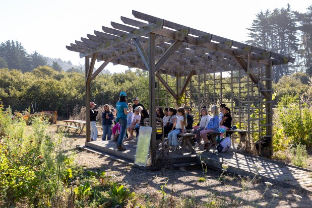 Sara Neale, farm educator at the HEAL Project, takes a group of El Granada Elementary School 3rd graders on a farm field trip Wednesday, Oct. 23, 2024, in Half Moon Bay, Calif. (Karl Mondon/Bay Area News Group)