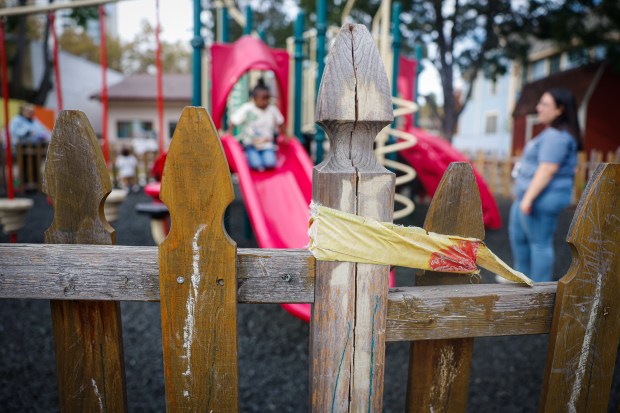 A fence is held together with caution tape at San Jose Day Nursery in San Jose, Calif., on Friday, Oct. 25, 2024. (Shae Hammond/Bay Area News Group)