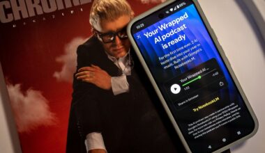 A photo of the Spotify Wrapped AI podcast on a smartphone screen on top of a magazine about music